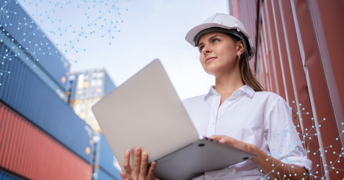 field service manager with laptop in shipping port