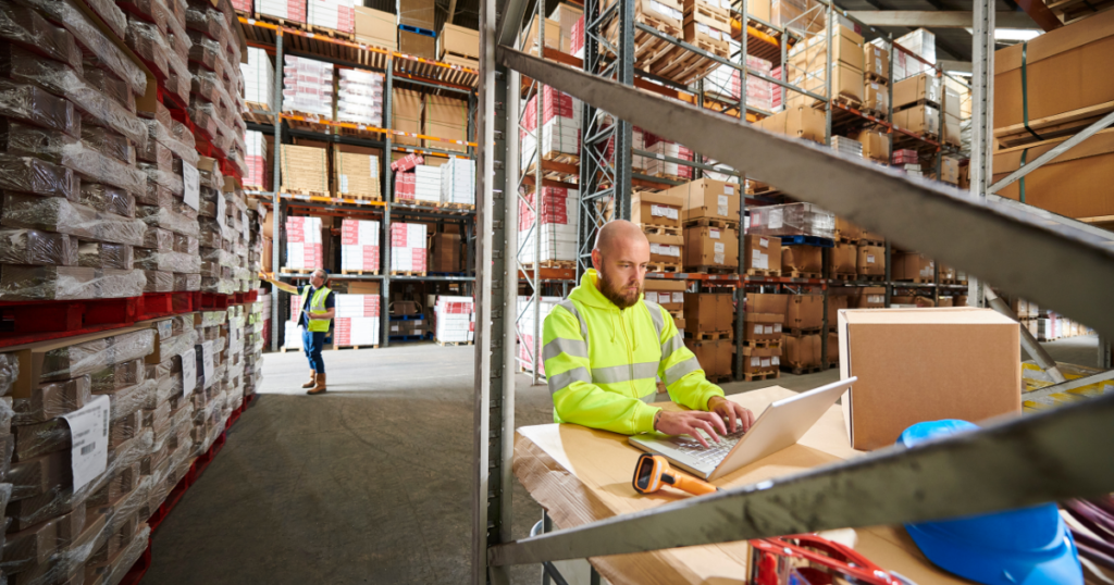 warehouse workers analyzing data to avoid stockouts