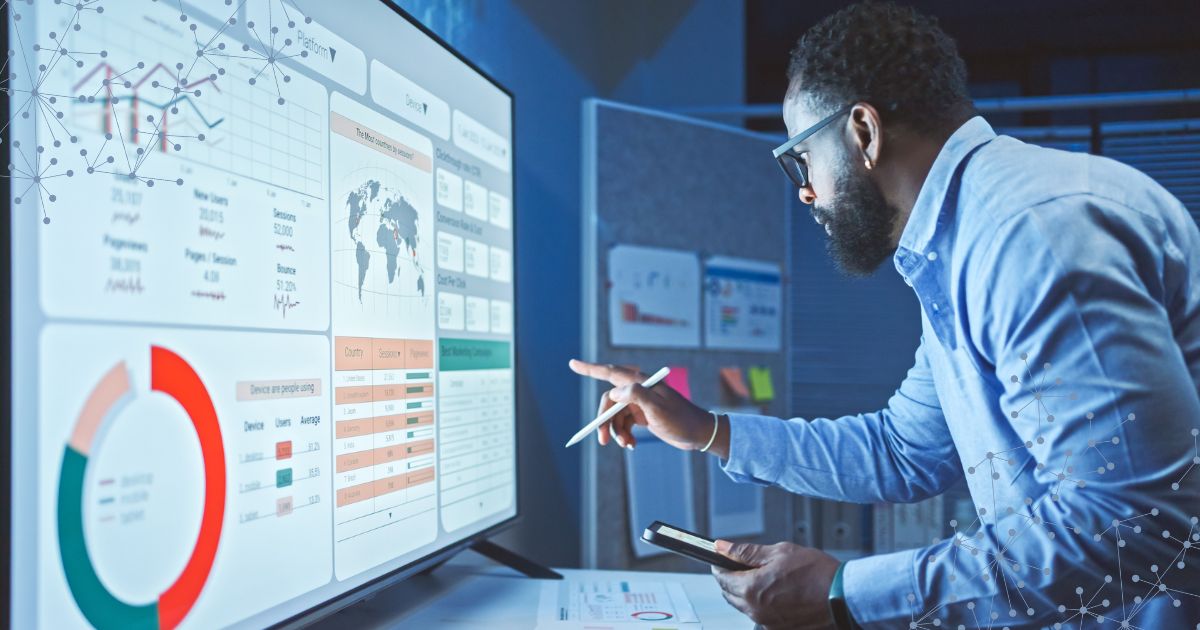 Analyst reviewing global service parts logistics data visualization on digital screen